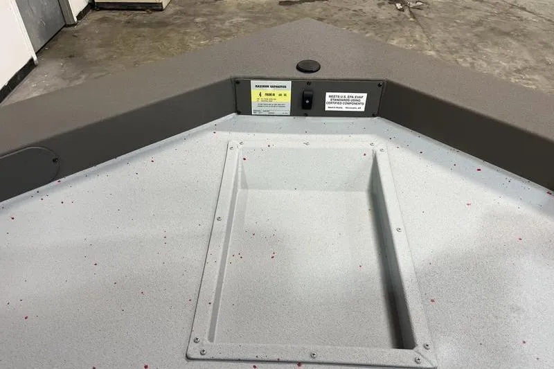 Slide: The Image of 2026 SeaArk Flex 19 Pro boat interior with storage compartment and control panel. - 17