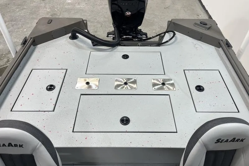 Slide: The Image of 2026 SeaArk Flex 19 Pro boat deck with storage compartments and motor. - 5