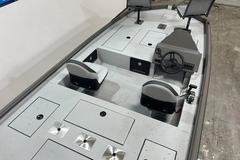 Slide: The Image of 2026 SeaArk Flex 19 Pro boat interior with dual seats and steering console. - 7