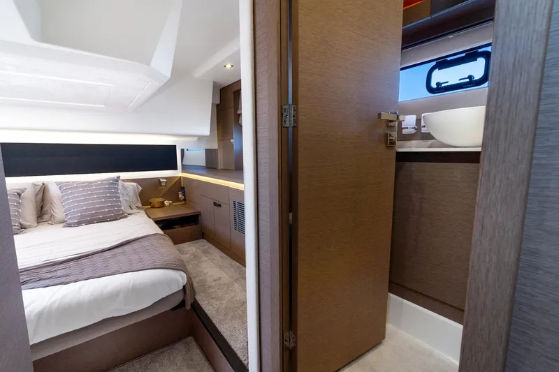 Slide: The Image of Luxurious interior of 2020 Prestige 420 yacht featuring bedroom and bathroom. - 35