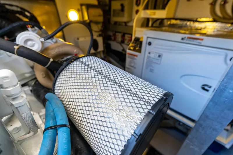 Slide: The Image of Engine room of 2020 Prestige 420 yacht with visible machinery and components. - 41