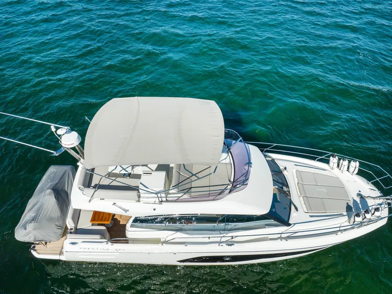 Slide: The Image of Prestige 420 yacht, 2020 model, cruising on clear blue water. - 7