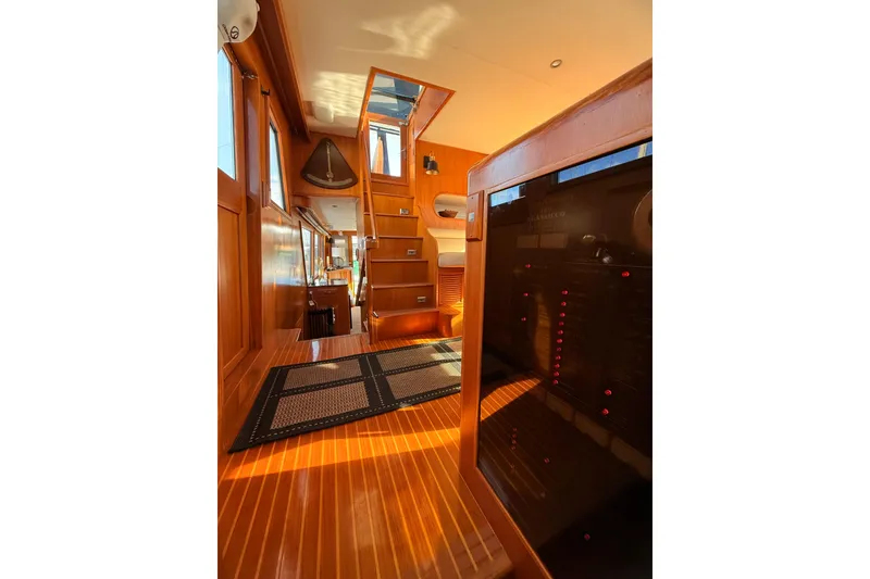 Slide: The Image of Interior of 1997 Ocean Alexander 486 Pilothouse with wooden flooring and stairs. - 11