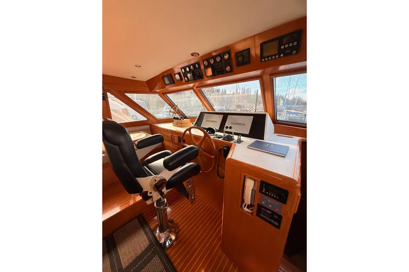 Slide: The Image of 1997 Ocean Alexander 486 Pilothouse interior with navigation equipment and captain's chair. - 15
