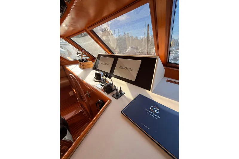 Slide: The Image of Pilothouse interior of 1997 Ocean Alexander 486 with Garmin navigation displays. - 16