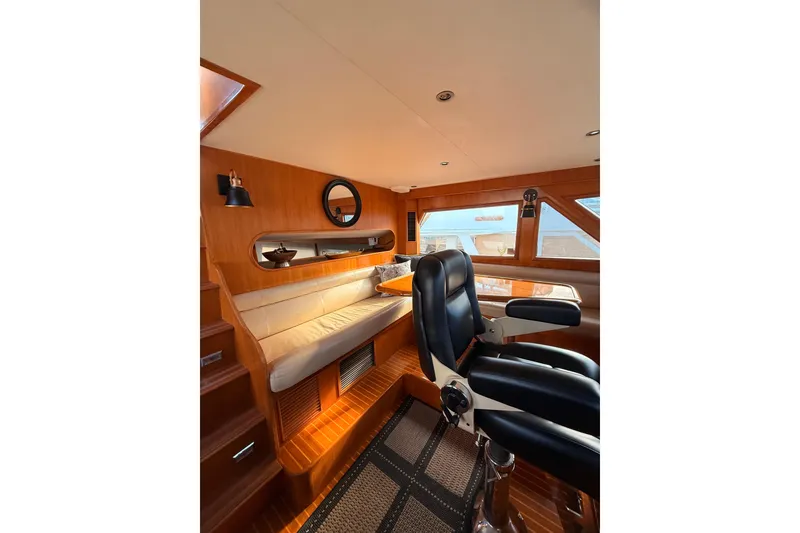 Slide: The Image of Luxurious 1997 Ocean Alexander 486 Pilothouse interior with leather seating and wooden accents. - 17