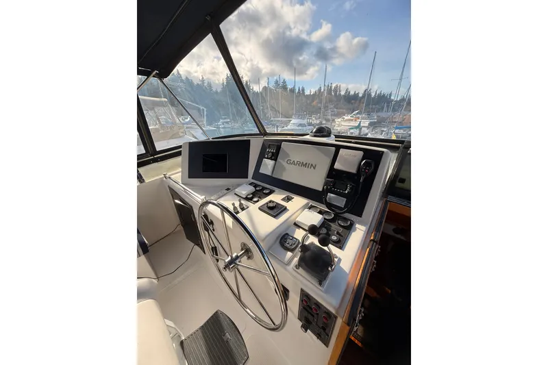 Slide: The Image of 1997 Ocean Alexander 486 Pilothouse helm with Garmin navigation system, marina view. - 23