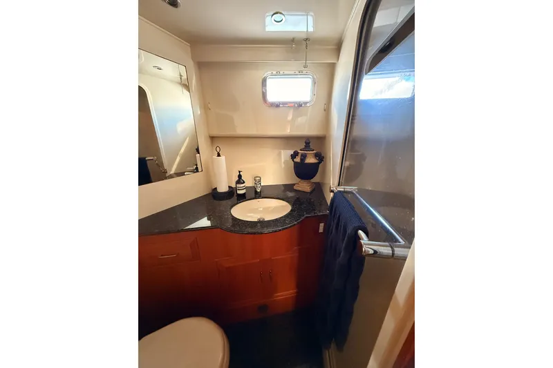 Slide: The Image of Bathroom interior of 1997 Ocean Alexander 486 Pilothouse yacht, featuring sink and shower. - 27