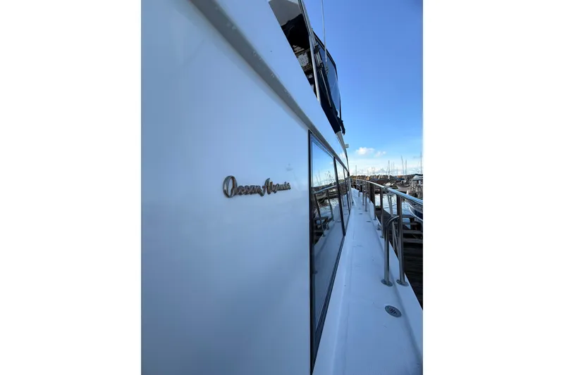 Slide: The Image of Wooden staircase inside 1997 Ocean Alexander 486 Pilothouse yacht. - 34