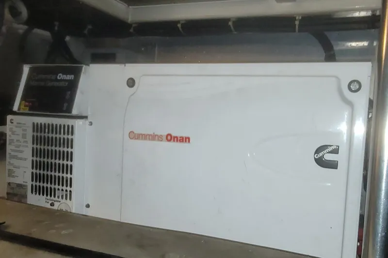 Slide: The Image of Engine room of a 1997 Ocean Alexander 486 Pilothouse yacht, showcasing mechanical components. - 37