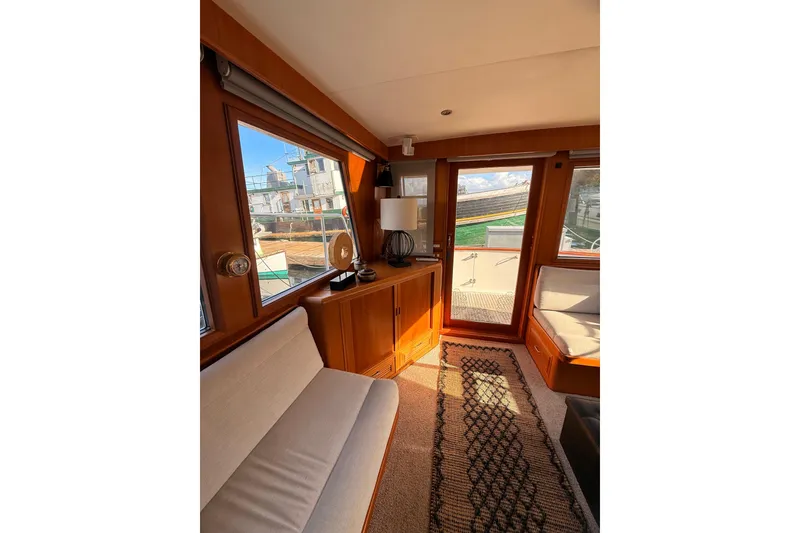 Slide: The Image of Interior of 1997 Ocean Alexander 486 Pilothouse with wooden accents and cozy seating. - 8