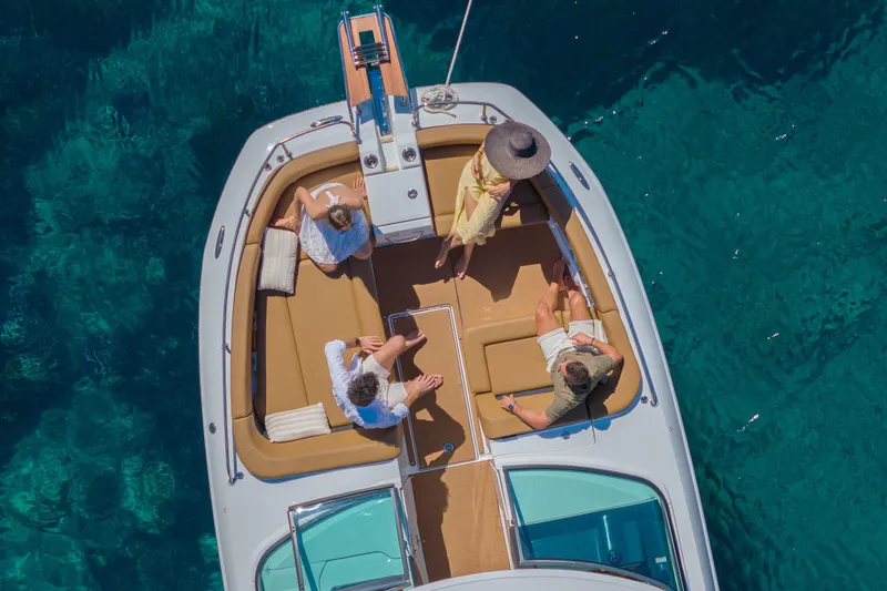 Slide: The Image of Aerial view of Jeanneau TH33 boat, 2026 model, with people relaxing on deck. - 6