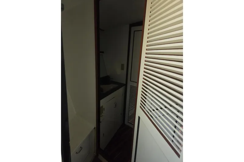 Slide: The Image of 1988 Symbol 44' Sportfish boat propeller and rudder under maintenance. - 33