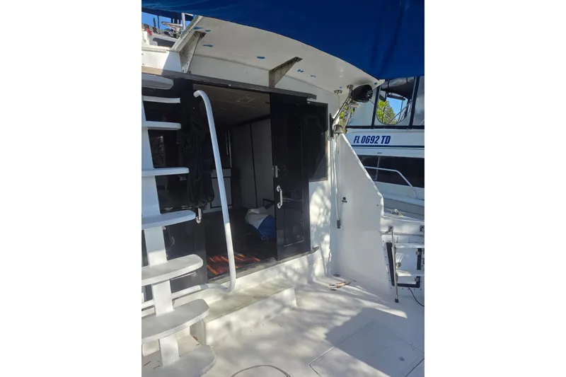 Slide: The Image of 1988 Symbol 44' Sportfish boat with ladder and deck view. - 7