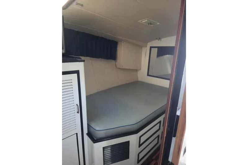 Slide: The Image of Interior of 1988 Symbol 44' Sportfish boat with modern amenities and wood flooring. - 27