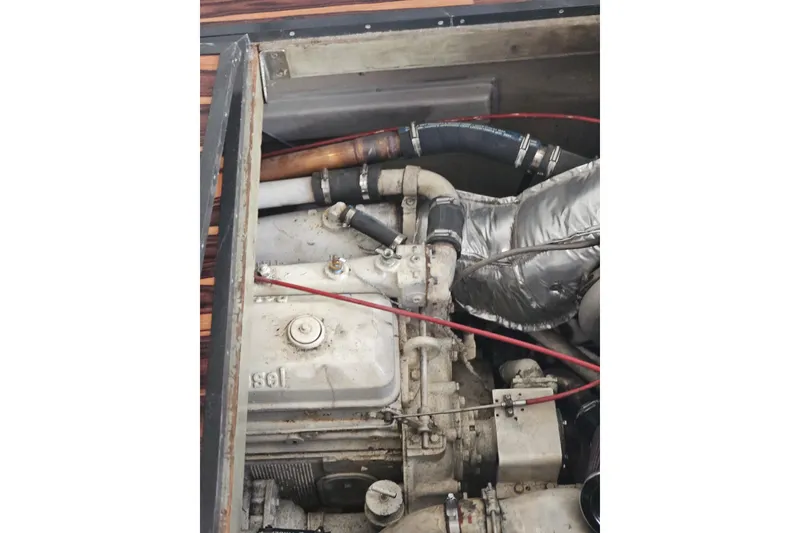 Slide: The Image of Engine compartment of a 1988 Symbol 44' Sportfish boat, showing mechanical components. - 36
