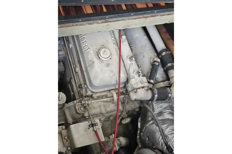 Slide: The Image of Engine compartment of a 1988 Symbol 44' Sportfish boat, showing mechanical components. - 38