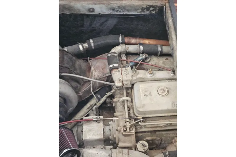 Slide: The Image of Engine compartment of a 1988 Symbol 44' Sportfish boat, showing mechanical components. - 39