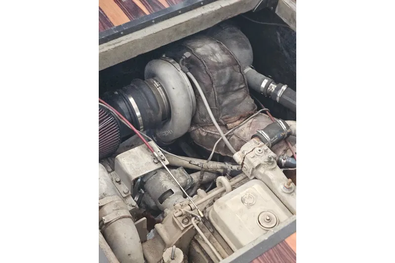 Slide: The Image of Engine compartment of a 1988 Symbol 44' Sportfish boat, showcasing mechanical components. - 40