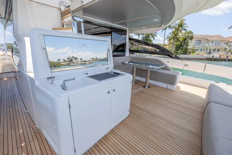 Slide: The Image of Luxurious 2023 Azimut S8 yacht deck with outdoor kitchen and seating area. - 12