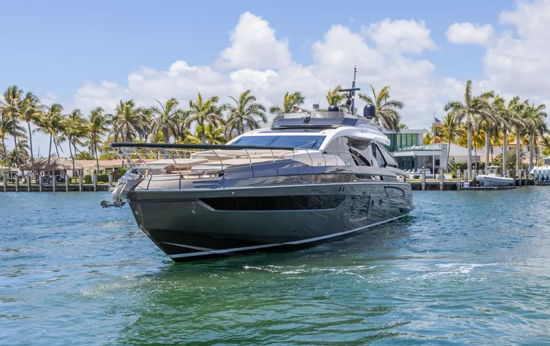 Slide: The Image of 2023 Azimut S8 yacht cruising on a sunny day with palm trees in the background. - 3