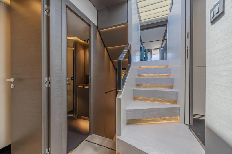 Slide: The Image of Luxurious interior of 2023 Azimut S8 yacht featuring modern staircase and elegant design. - 43
