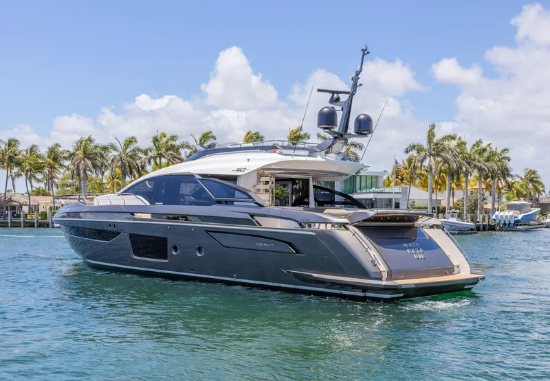 Slide: The Image of Luxury 2023 Azimut S8 yacht cruising on a sunny day with palm trees in the background. - 6