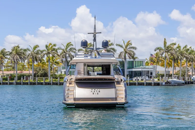 Slide: The Image of 2023 Azimut S8 yacht on water, surrounded by palm trees and luxury waterfront homes. - 8