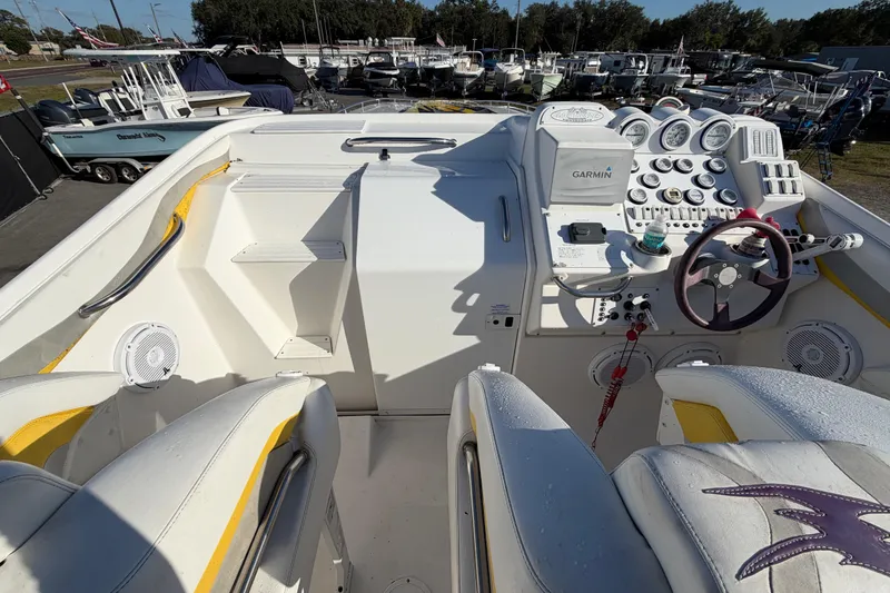 Slide: The Image of Cockpit of 1999 Black Thunder XT-430 boat with steering wheel and control panel. - 15