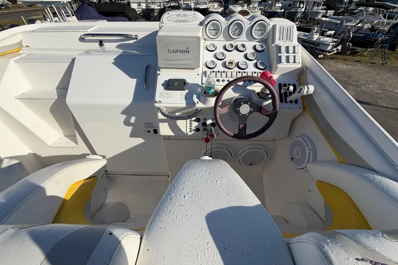 Slide: The Image of Cockpit of 1999 Black Thunder XT-430 boat with Garmin navigation system and steering wheel. - 18
