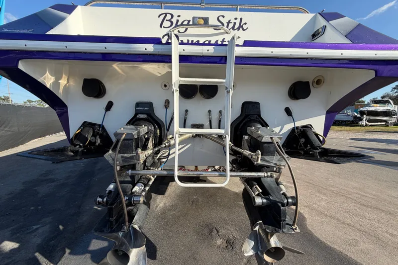 Slide: The Image of Rear view of 1999 Black Thunder XT-430 boat with dual propellers. - 2