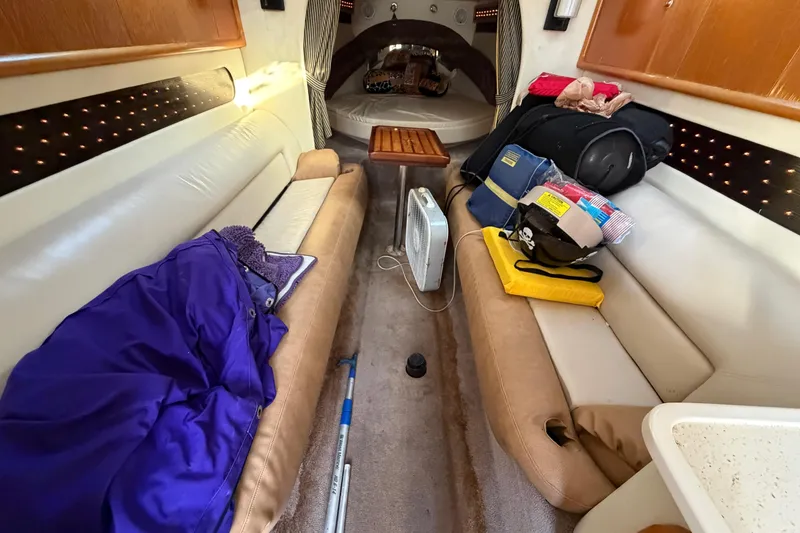 Slide: The Image of Interior of a 1999 Black Thunder XT-430 boat with seating and storage. - 28