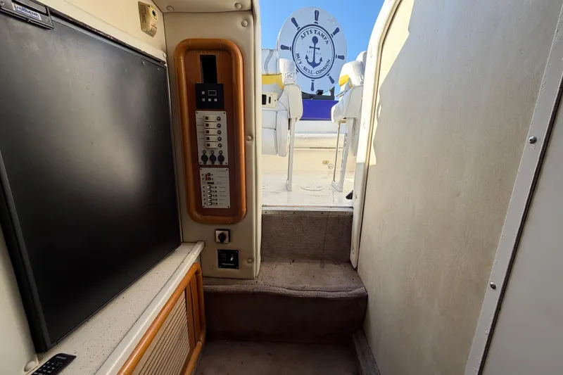 Slide: The Image of Interior view of 1999 Black Thunder XT-430 boat, featuring control panel and seating area. - 32