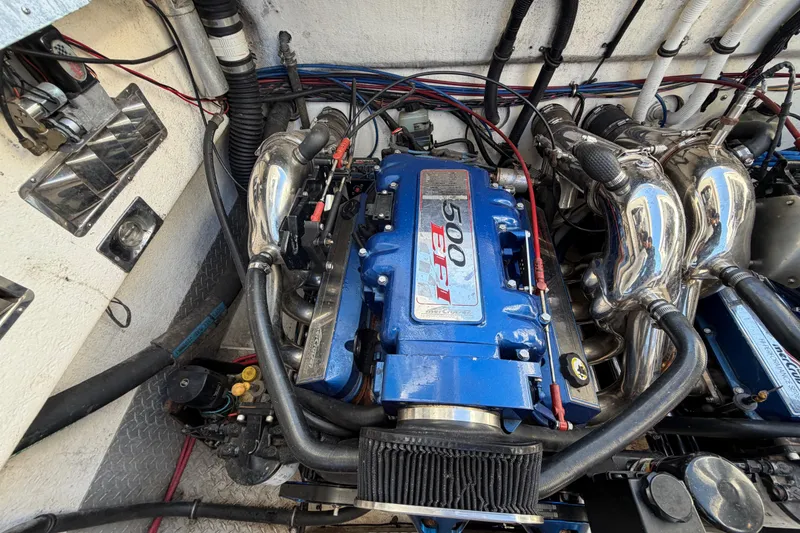 Slide: The Image of Engine compartment of a 1999 Black Thunder XT-430 with a 500 EFI engine. - 42