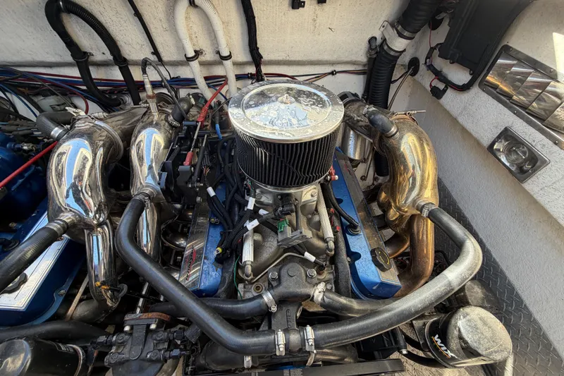 Slide: The Image of Engine compartment of a 1999 Black Thunder XT-430 with visible components and wiring. - 43