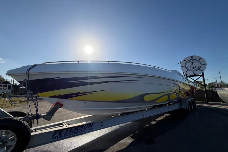 Slide: The Image of 1999 Black Thunder XT-430 boat on trailer under bright sun. - 7