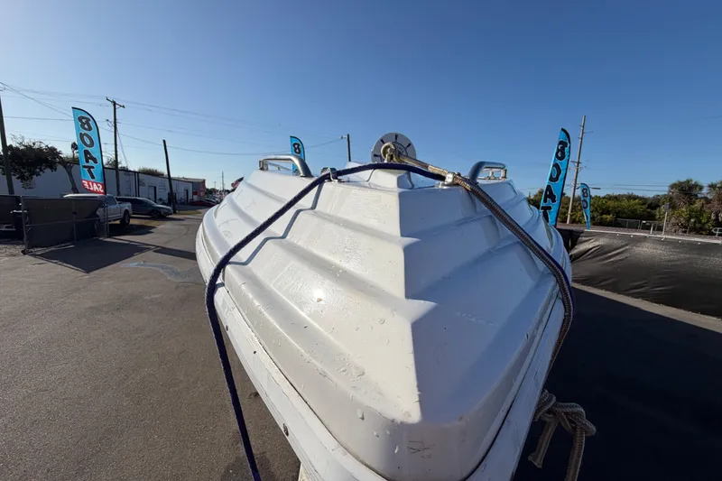 Slide: The Image of 1999 Black Thunder XT-430 boat on display at a sales lot under clear skies. - 9