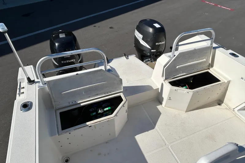 Slide: The Image of 1995 Sea Cat 255 with Suzuki engines and storage compartments. - 17