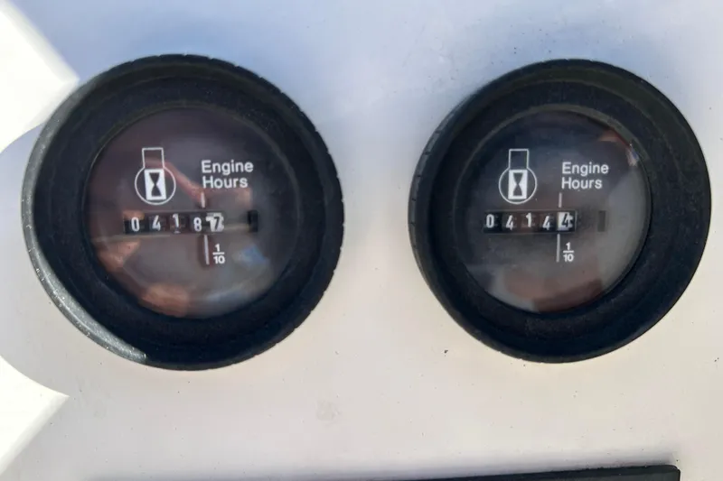 Slide: The Image of Engine hour meters on 1995 Sea Cat 255 center console. - 18