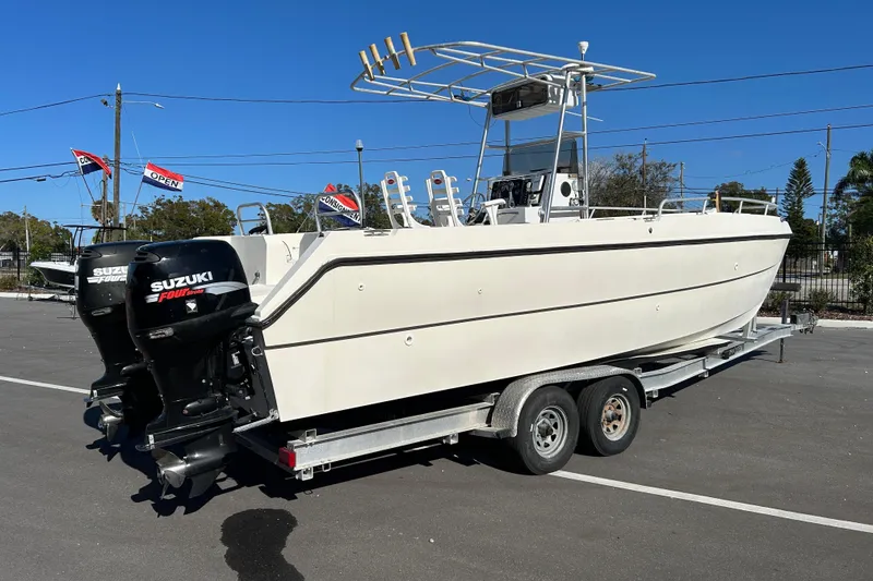 Slide: The Image of 1995 Sea Cat 255 center console on trailer, Suzuki engines. - 2