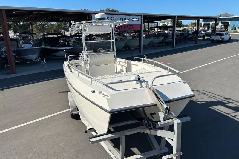 Slide: The Image of 1995 Sea Cat 255 Center Console on trailer outdoors. - 6