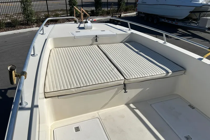 Slide: The Image of 1995 Sea Cat 255 center console with cushioned seating. - 8