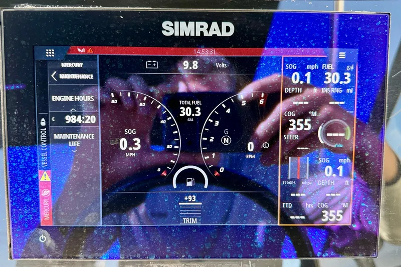 Slide: The Image of Simrad display on 2023 Sea Ray SPX 210 Outboard showing engine and navigation data. - 17