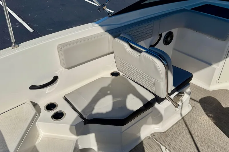 Slide: The Image of 2023 Sea Ray SPX 210 Outboard boat interior with seating and cup holders. - 22
