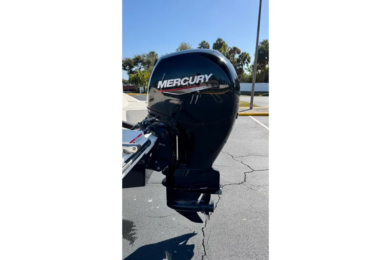 Slide: The Image of 2023 Sea Ray SPX 210 Outboard with Mercury engine in a sunny outdoor setting. - 25