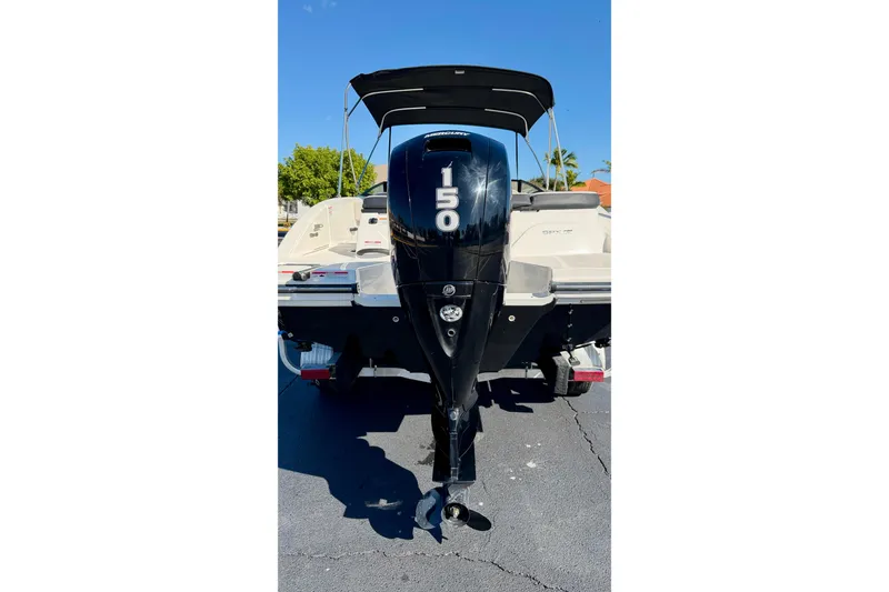 Slide: The Image of 2023 Sea Ray SPX 210 Outboard boat with 150 HP engine, rear view. - 26