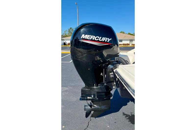 Slide: The Image of 2023 Sea Ray SPX 210 Outboard with Mercury engine, parked outdoors. - 27