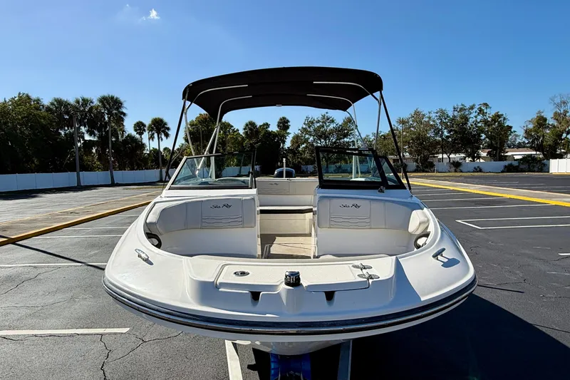 Slide: The Image of 2023 Sea Ray SPX 210 Outboard boat in parking lot, sunny day. - 3