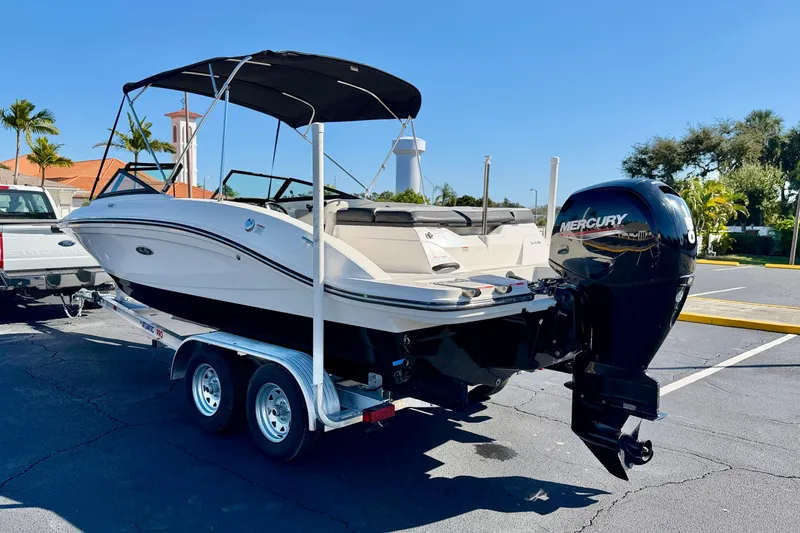 Slide: The Image of 2023 Sea Ray SPX 210 Outboard boat on trailer, featuring Mercury engine. - 5