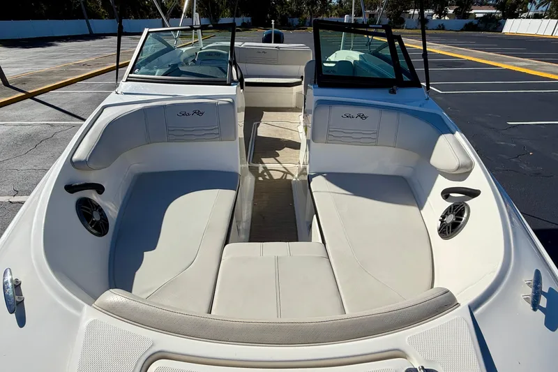 Slide: The Image of 2023 Sea Ray SPX 210 Outboard boat interior with spacious seating and modern design. - 8